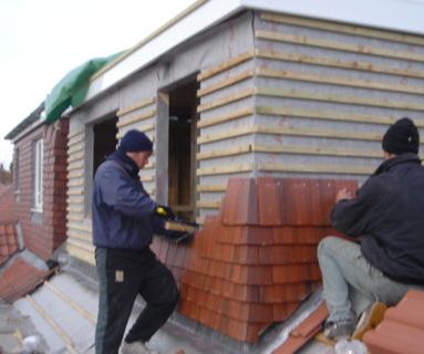 Roofers working on a roof conversion