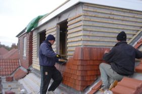 Roofers working on a roof installation 