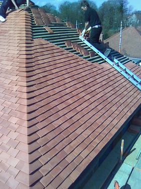 Tiles being fitted on roof
